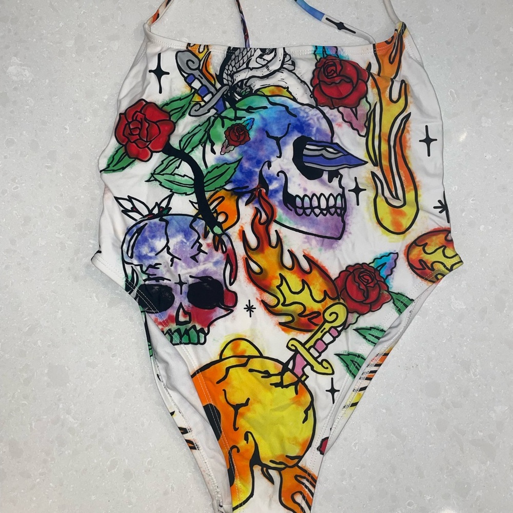 Jaded London one piece with graphic skull design USA 6, fits like a small or 4